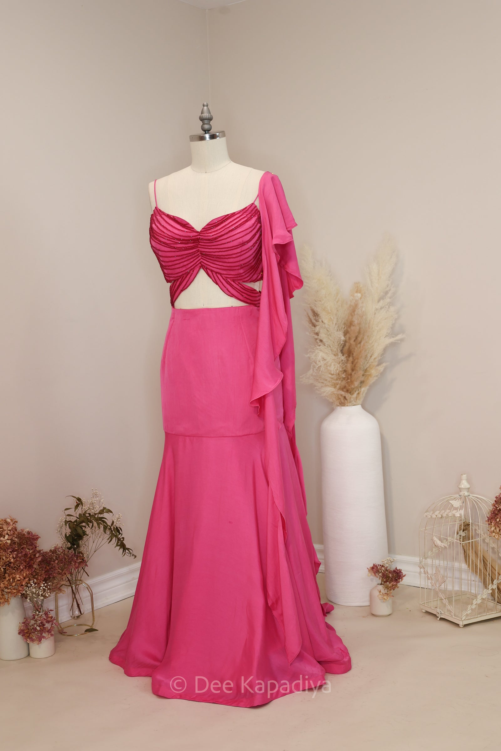 Peacock blue butterfly croptop embellished with hand stitched crystal beads, a mermaid style skirt lehenga, and ruffle dupatta. Perfect for sangeet, pre and post wedding events.