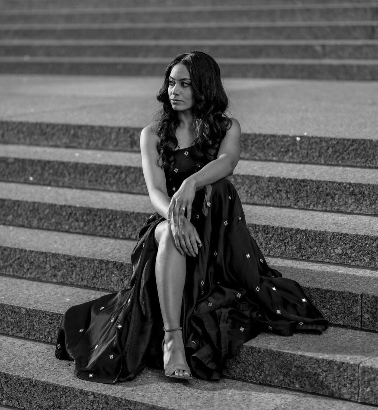 Gorgeous black lehenga set with real mirror work embroidery in light gold zari with one shoulder crop top