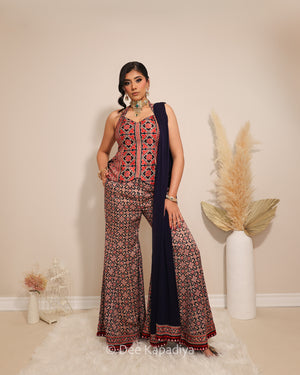 Dee Kapadiya Bahaar Gharara Set in Jamuni Blue — Mastani halter top and wide-leg gharara in geometric ajrakh print on gajji silk with real mirror work border, front view, Indian wedding guest outfit , sangeet mehndi outfit Toronto