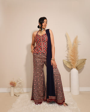 Dee Kapadiya Bahaar Gharara Set in Jamuni Blue — Mastani halter top and wide-leg gharara in geometric ajrakh print on gajji silk with real mirror work border, front view, Indian wedding guest outfit Canada