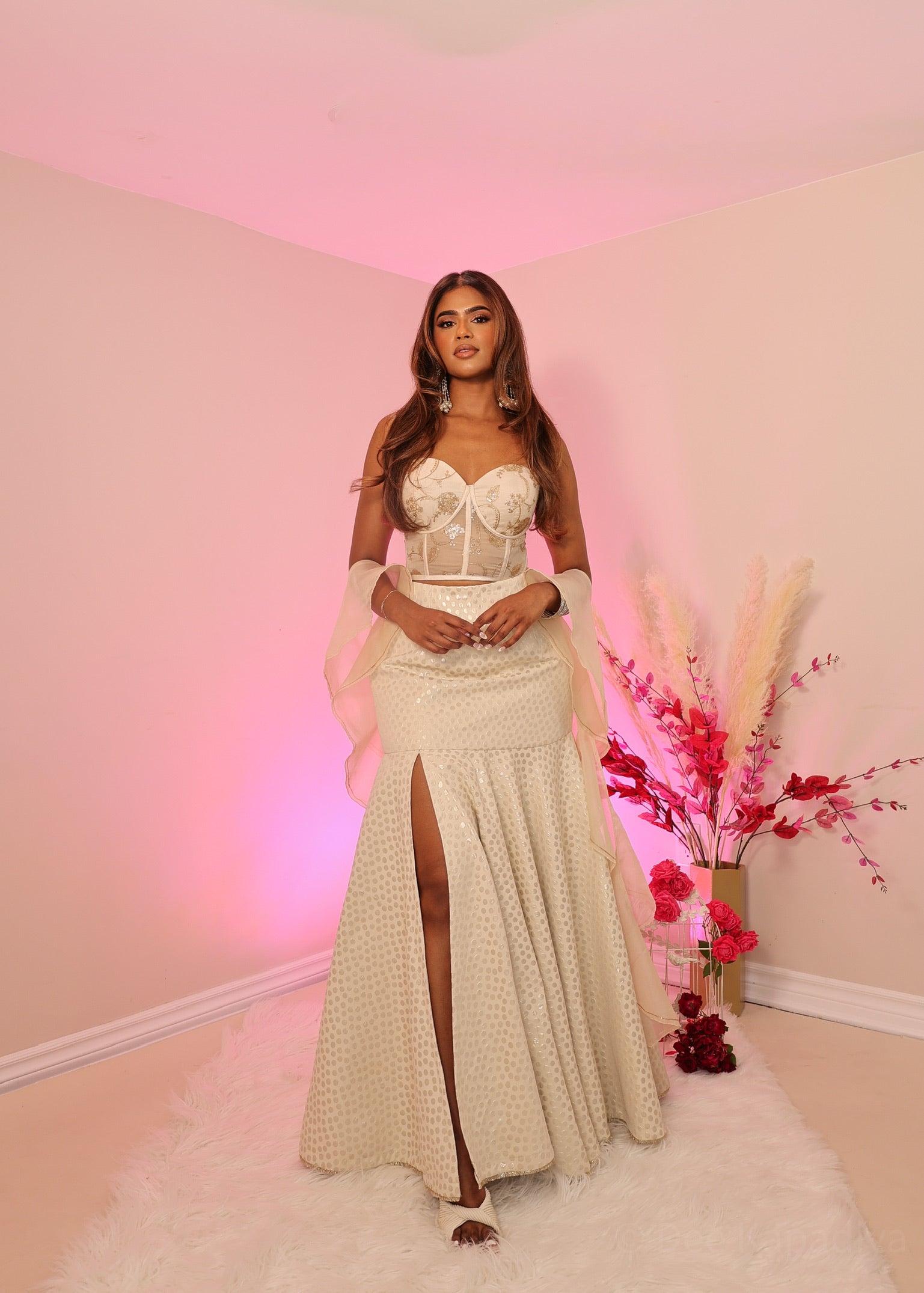 Ecru colour in gold embellishments corset with polka dot champage marmaid style lehenga skirt with flowy ruffle oraganza shawl