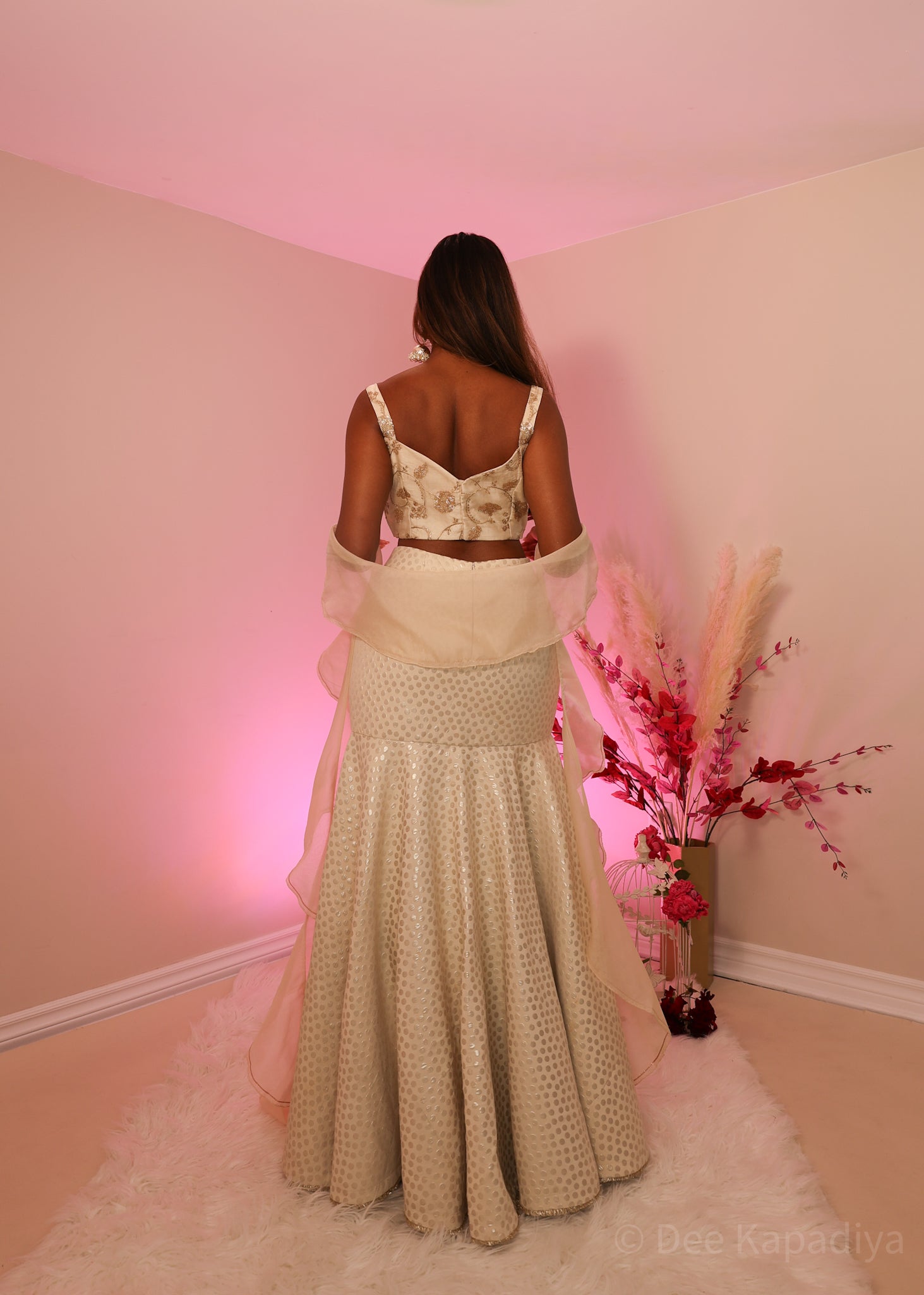 Ecru colour organza croptop with bronze embellishments, paired with champagne coloured polka dot mermaid style lehenga and organza ruffle shawl dupatta, perfect for bridal shower, wedding guest outfit or pre-wedding events 