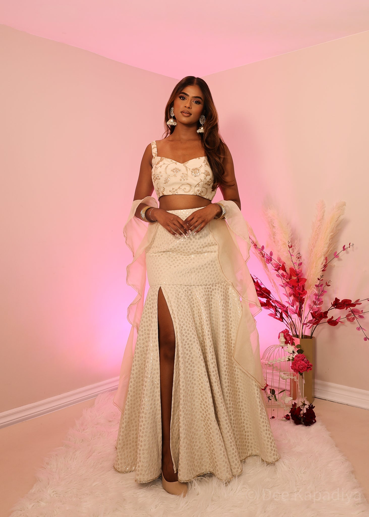 Ecru colour organza croptop with bronze embellishments, paired with champagne coloured polka dot mermaid style lehenga and organza ruffle shawl dupatta, perfect for bridal shower, wedding guest outfit or pre-wedding events 
