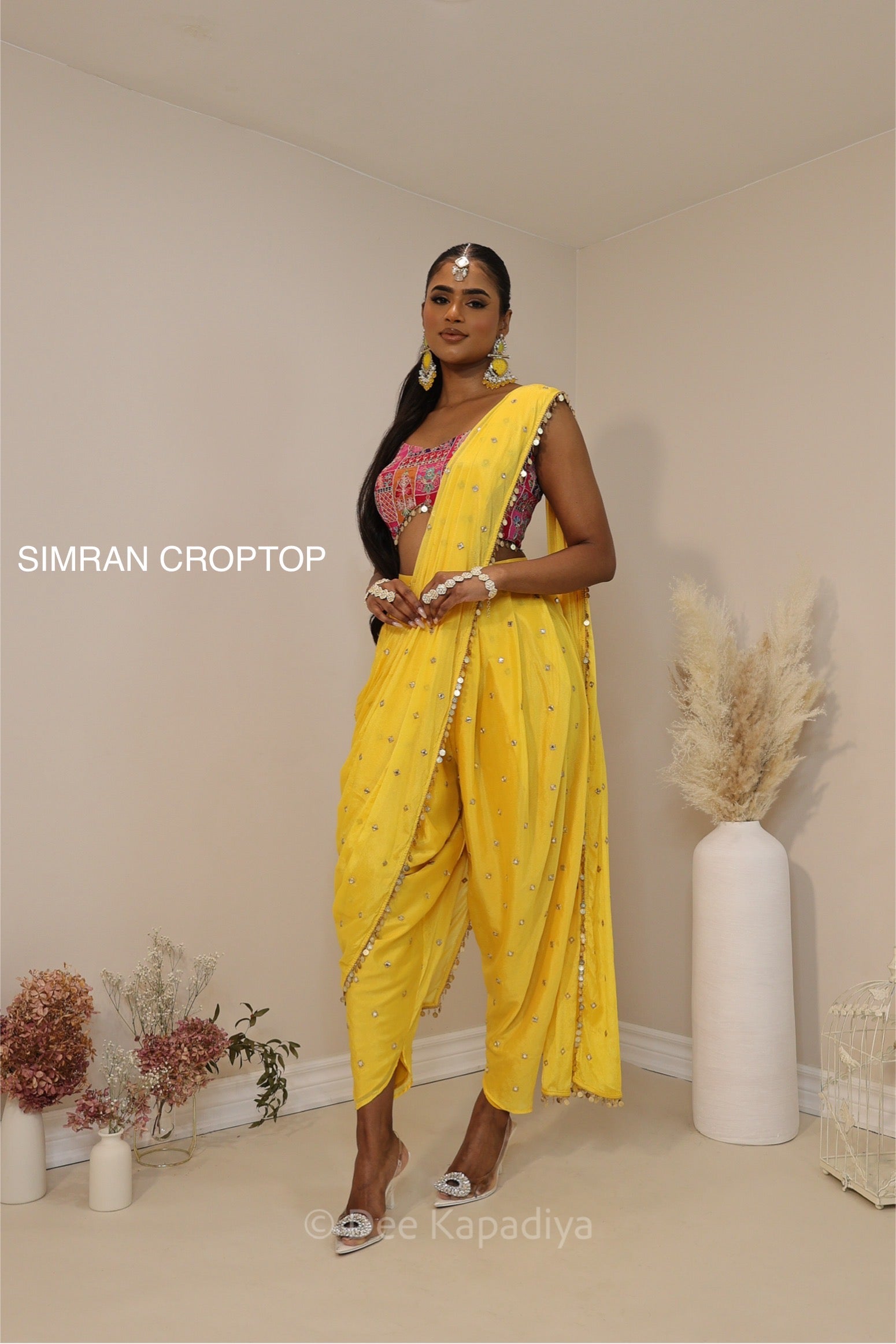 Ananya giving you all the yellow vibes in this gorgeous silky dhoti saree with hotpink croptop for haldi or fiesta event
