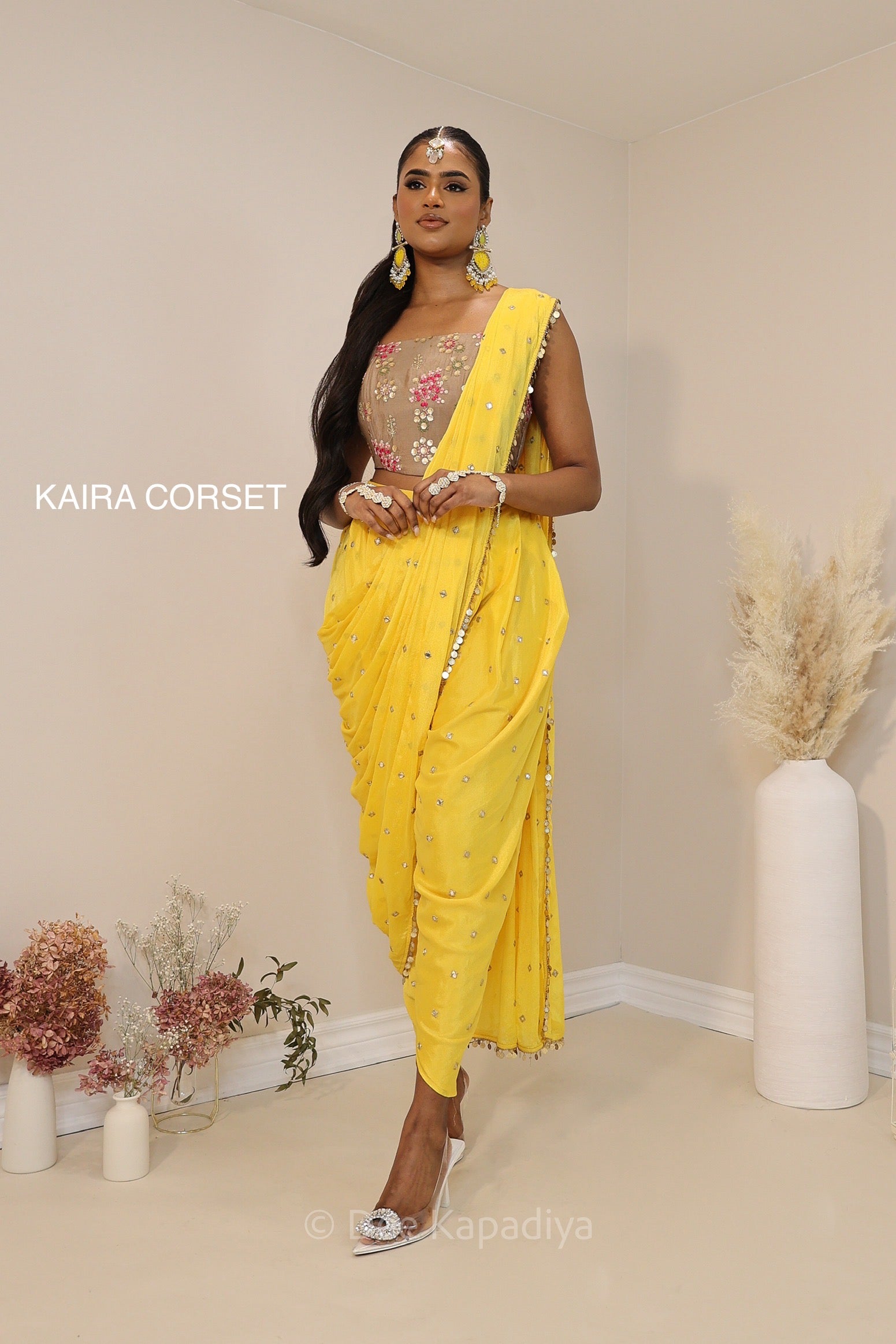 Ananya giving you all the yellow vibes in this gorgeous silky dhoti saree with hotpink croptop for haldi or fiesta event