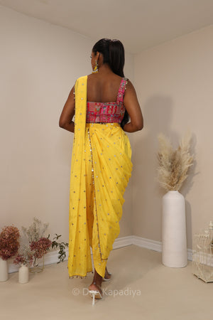 Ananya giving you all the yellow vibes in this gorgeous silky dhoti saree with hot pink printed corset for haldi or fiesta event