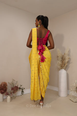 Ananya giving you all the yellow vibes in this gorgeous silky dhoti saree with hot pink corset for haldi or fiesta event
