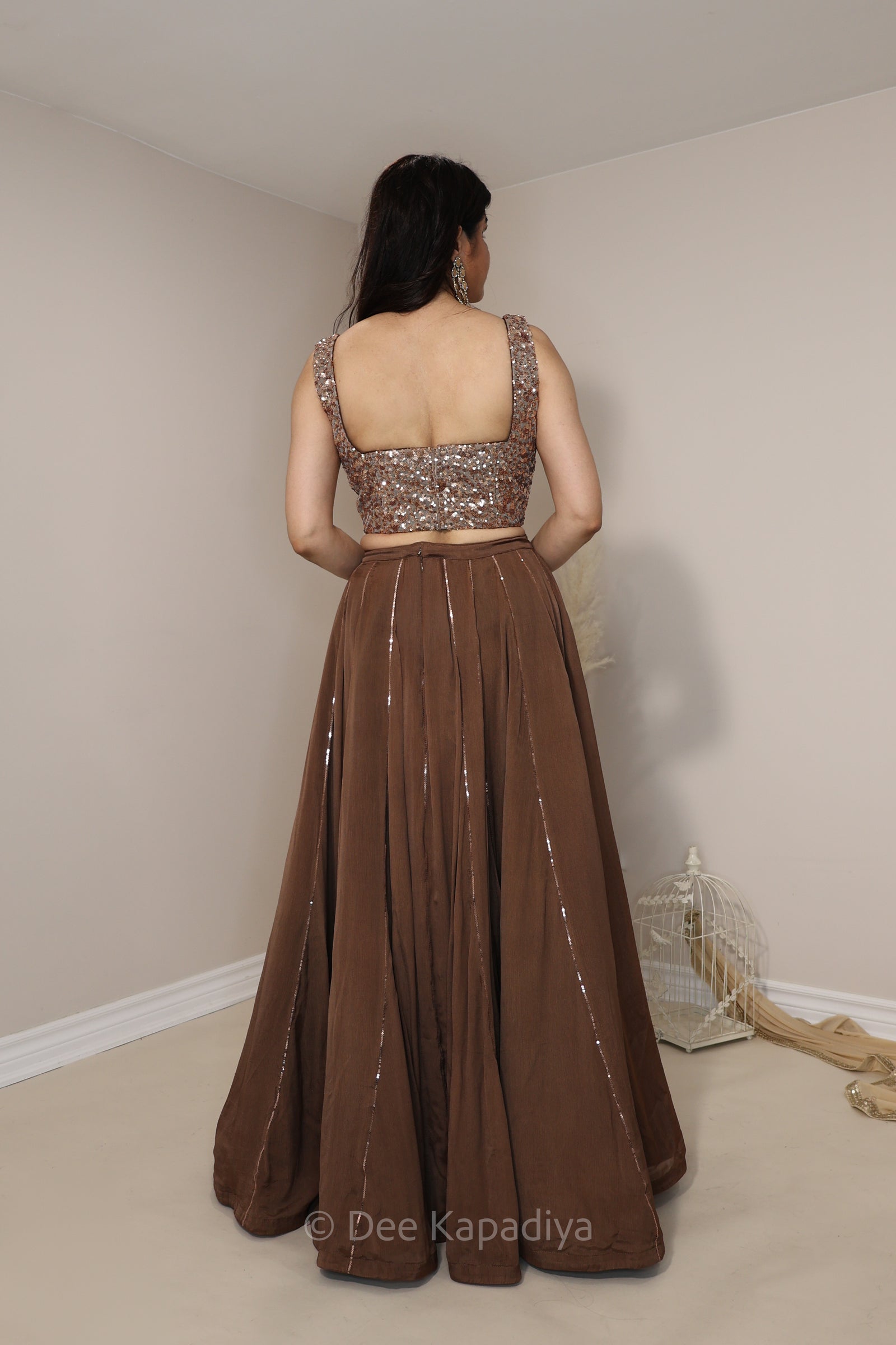 Modern and chic corset copper bronze chocolate brown lehenga set for pre or post Indian or fusion inter cultural weddings. 