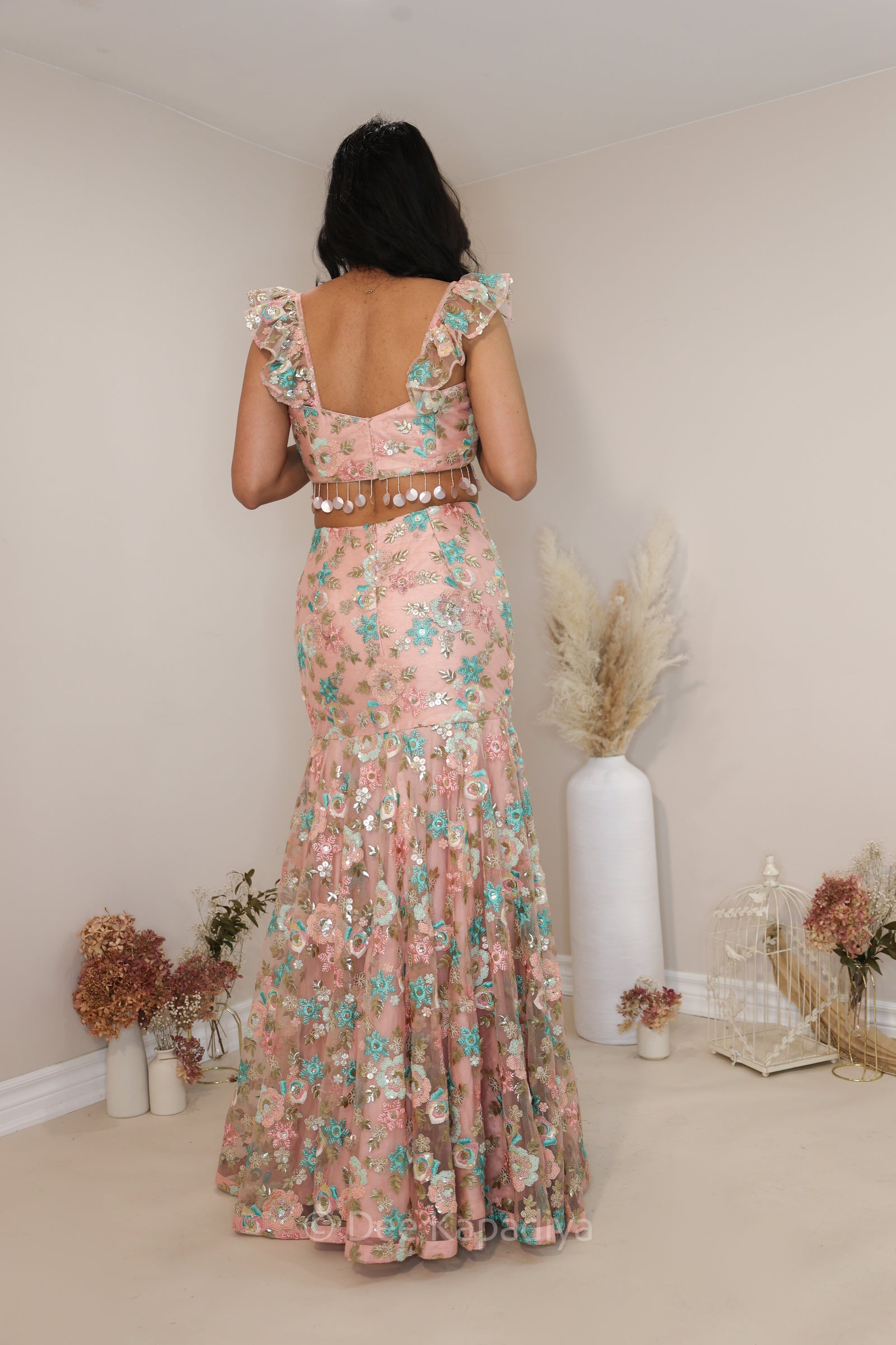 Modern and chic mermaid lehenga set in peach fuss in multicolour pastel for pre or post Indian or fusion inter cultural weddings. Perfect for your mehendi party, bridal shower, or as a wedding guest!