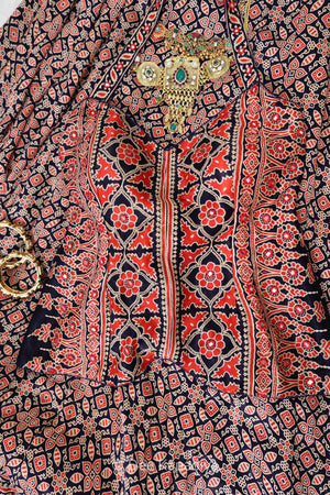 Close-up of geometric ajrakh screen print on gajji silk — Mastani top from the Bahaar Gharara Set by Dee Kapadiya