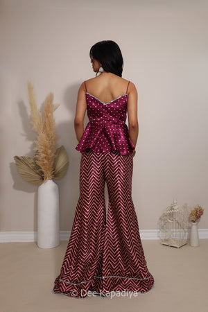Back view of Dee Kapadiya Nakhra Gharara Set in Masala showing the strappy peplum top and flared chevron pants