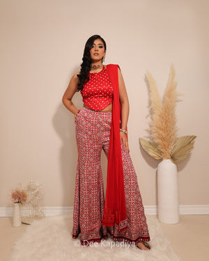 Dee Kapadiya Bahaar Gharara Set with Bahaar Crop Top Mirchi Red — bandhani gajji silk crop top with mirror zari work and wide-leg ajrakh gharara, Indian wedding guest outfit Canada