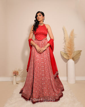 Dee Kapadiya Gehna Lehenga Set with Bahaar Crop Top Mirchi Red — bandhani round neck halter gajji silk top with mirror zari and full flared ajrakh lehenga, Indian wedding guest outfit Canada