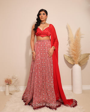 Dee Kapadiya Gehna Lehenga Set with Gehna Crop Top Mirchi Red — bandhani sweetheart crop top with mirror zari and full flared ajrakh lehenga in gajji silk, Indian wedding guest outfit Canada