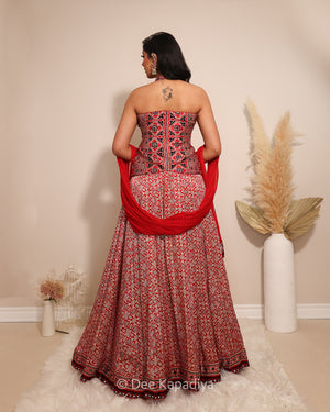 Dee Kapadiya Gehna Lehenga Set Mirchi Red — back view showing halter Mastani top and Gehna lehenga hem with ajrakh embroidered border and mirror work, mehndi sangeet outfit Toronto