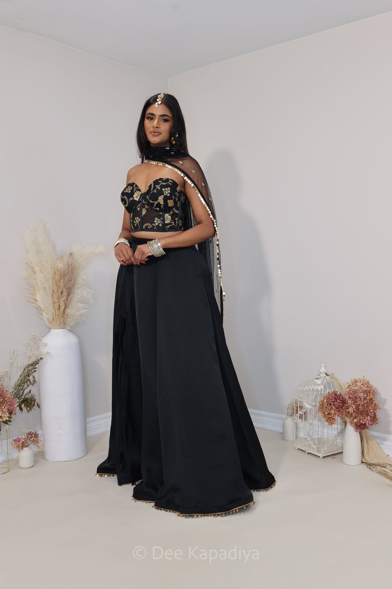 Classic black and gold lehenga loved by all desi girl, perfect for dancing and twirling with slit and pockets corset